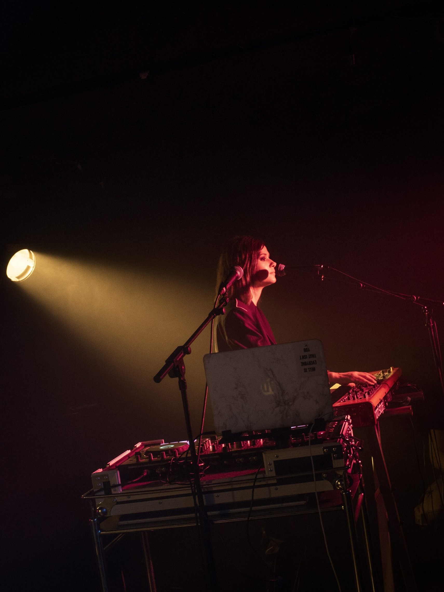 person singing playing keyboard