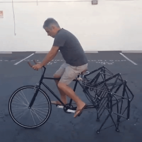 person cycling - unique back wheel